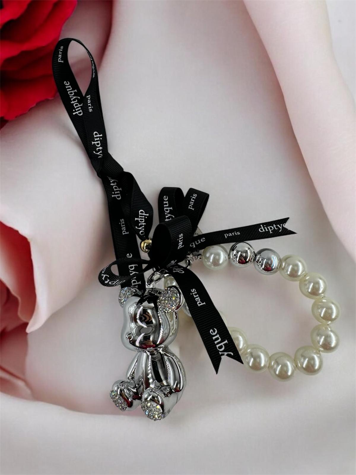 سلسلة مفاتيح على شكل دب الراكون