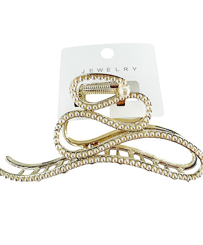 Gold hair clip studded with rhinestones