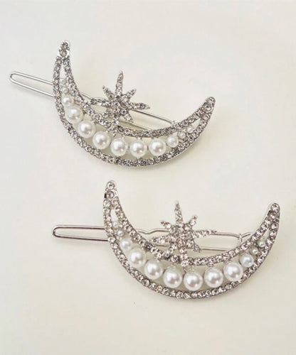 Hair Accessory in the shape of a crescent moon with a sun star ( 1 piece )