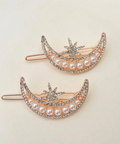 Hair Accessory in the shape of a crescent moon with a sun star ( 1 piece )