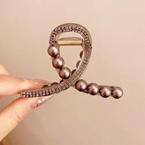 Brown hair clip studded with beads