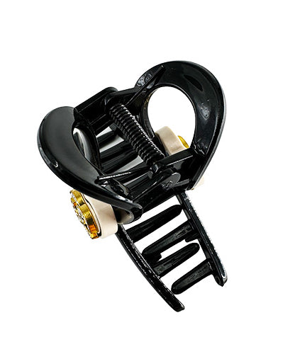 Hair Clip Black with a beige heart in the middle containing the Chanel symbol