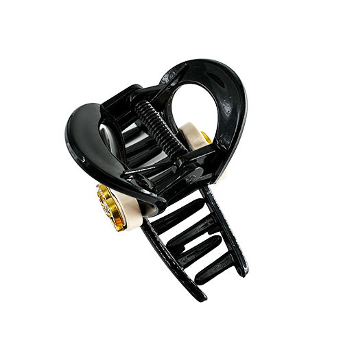 Hair Clip Black with a beige heart in the middle containing the Chanel symbol